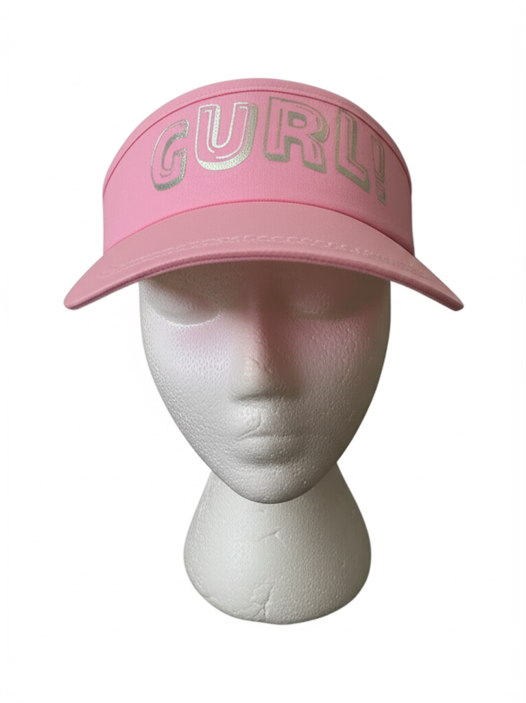 Pink cap with 'GURL!' text on a mannequin head against a white background