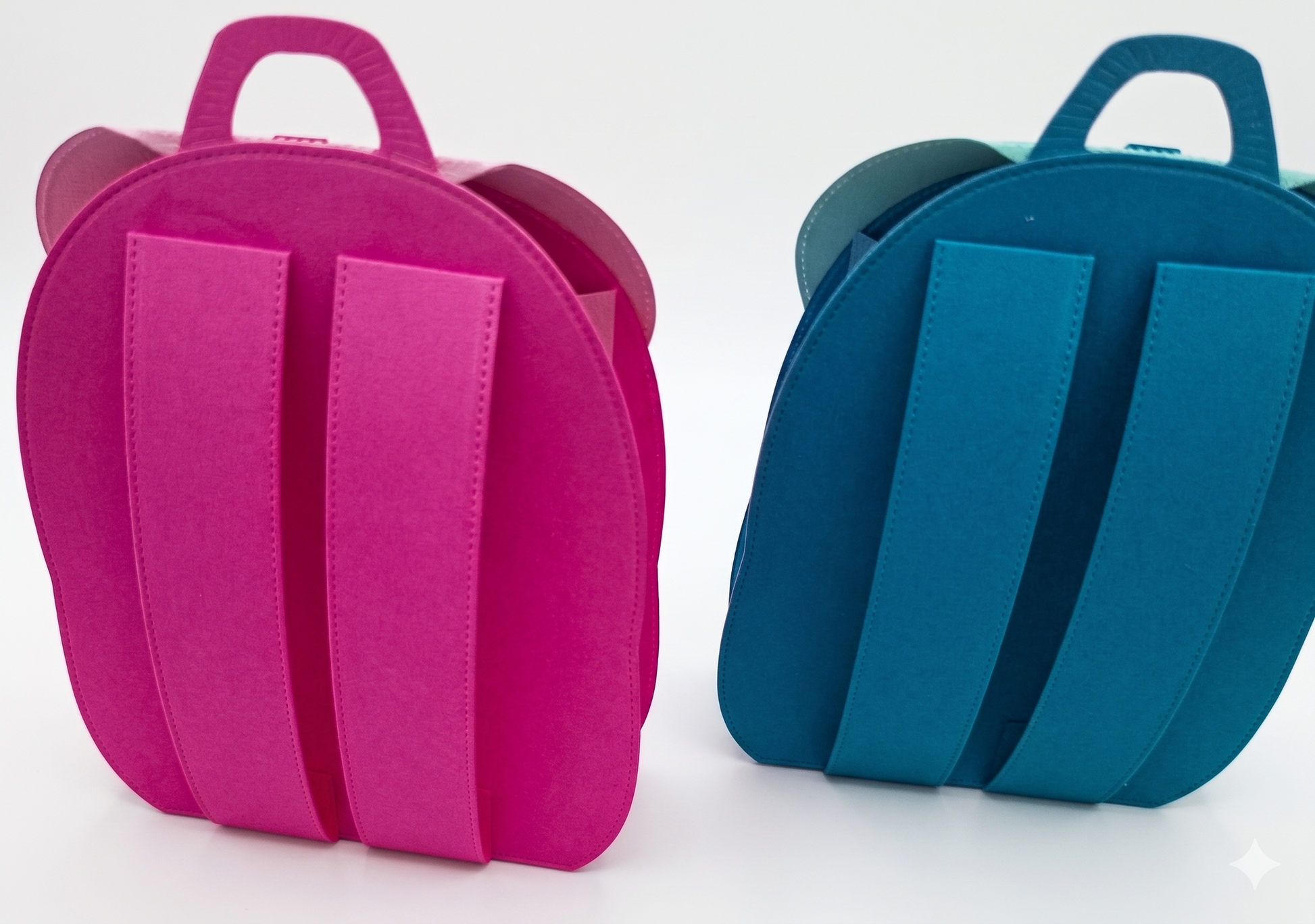 The backside view of the item is a mini crafted backpack that can hold small items. The 2 backpacks come in 2 colors blue or pink.